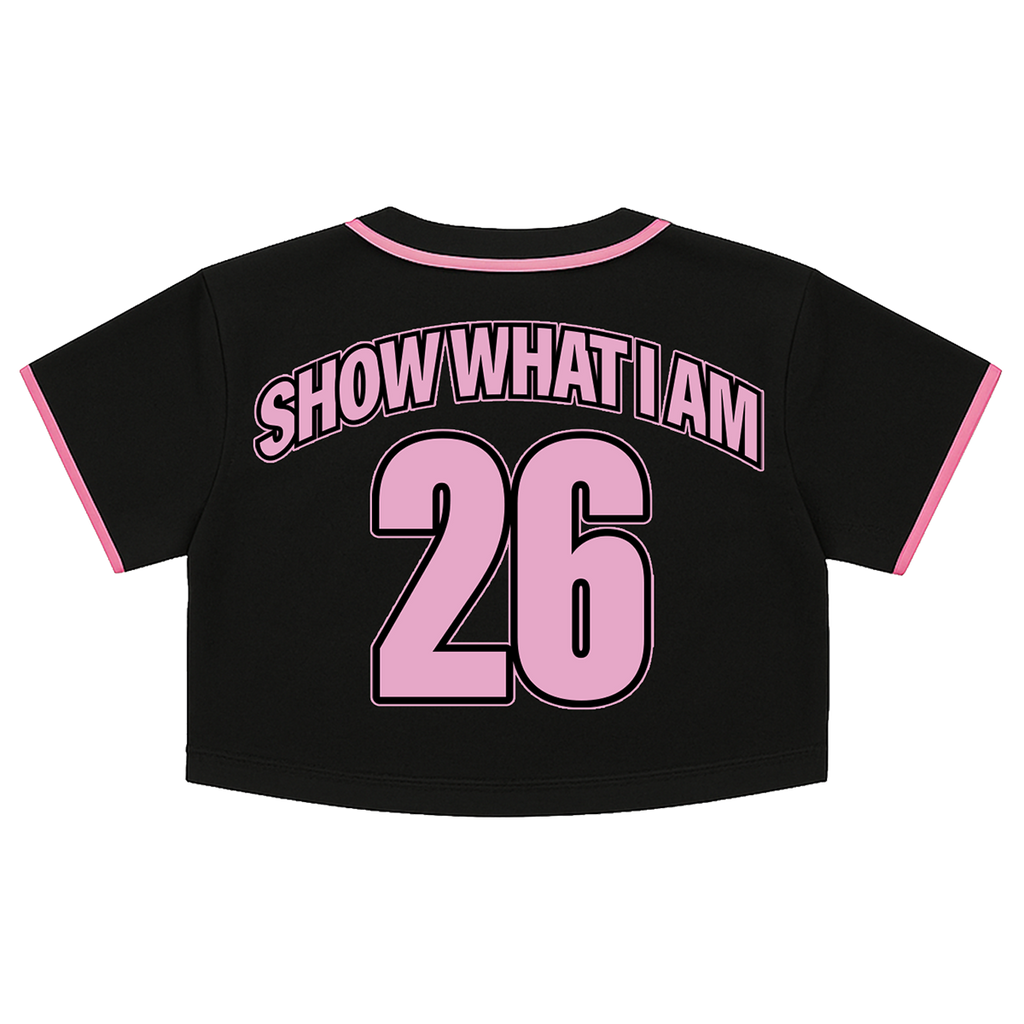 Black short-sleeve crop top with pink trim and the words 'SHOW WHAT I AM' above the number '26' on the back.