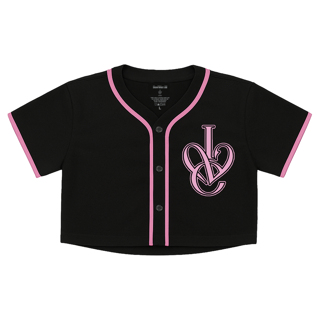 A black short-sleeve baseball-style crop top with pink trim along the collar, placket, and sleeve cuffs, featuring a large pink interlocking 'IVE' logo on the left chest.