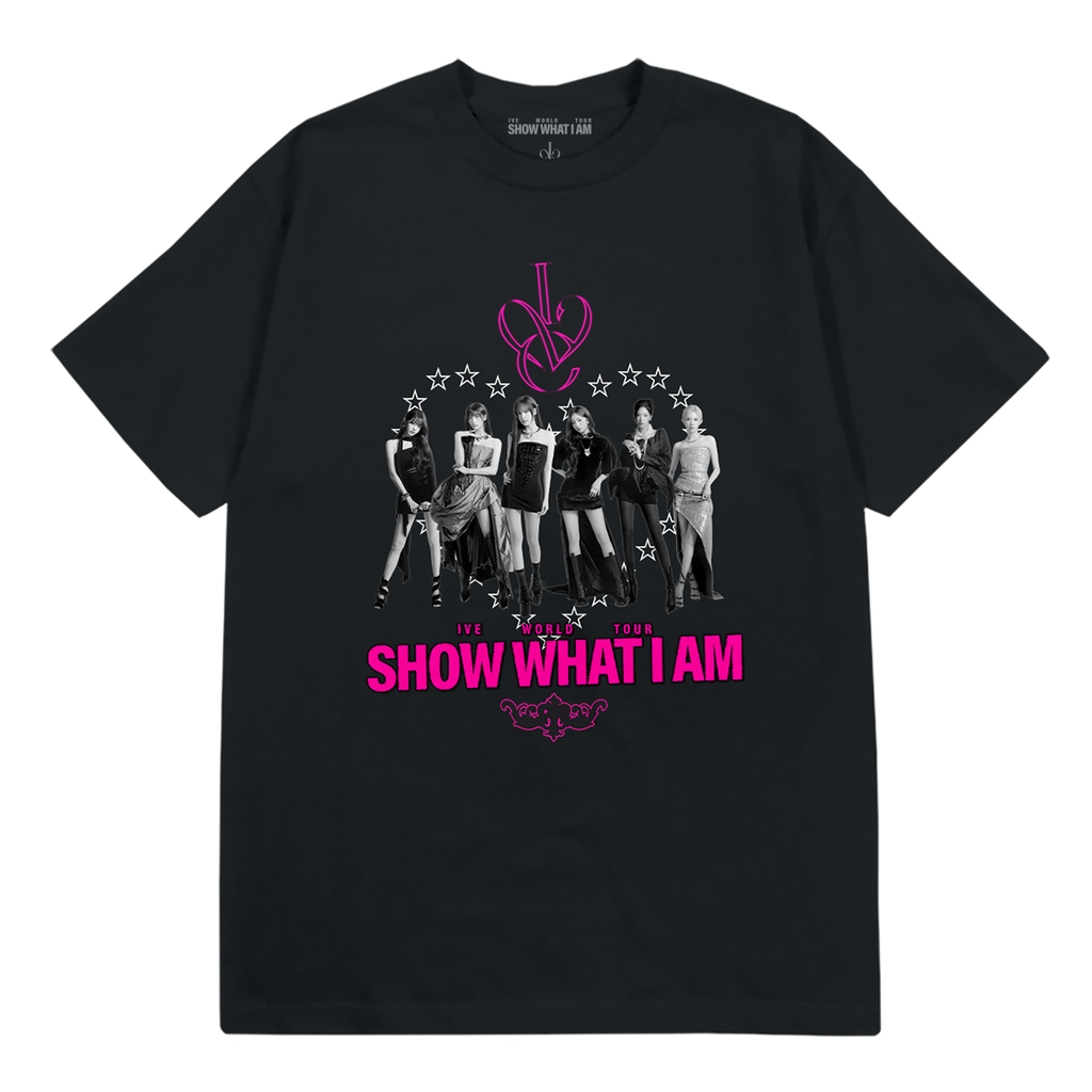 A black short-sleeve graphic t-shirt featuring a monochrome group photo of the K-pop group IVE, with a pink monogram logo above and the text 'SHOW WHAT I AM' in pink below.