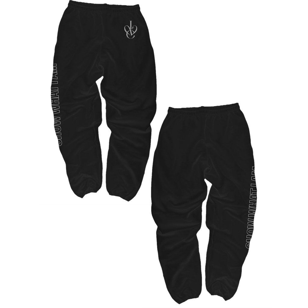 Black jogger sweatpants shown from two angles. One view shows the front with a small white script logo near the upper left hip, and the other shows the side with vertical white text running down the leg.