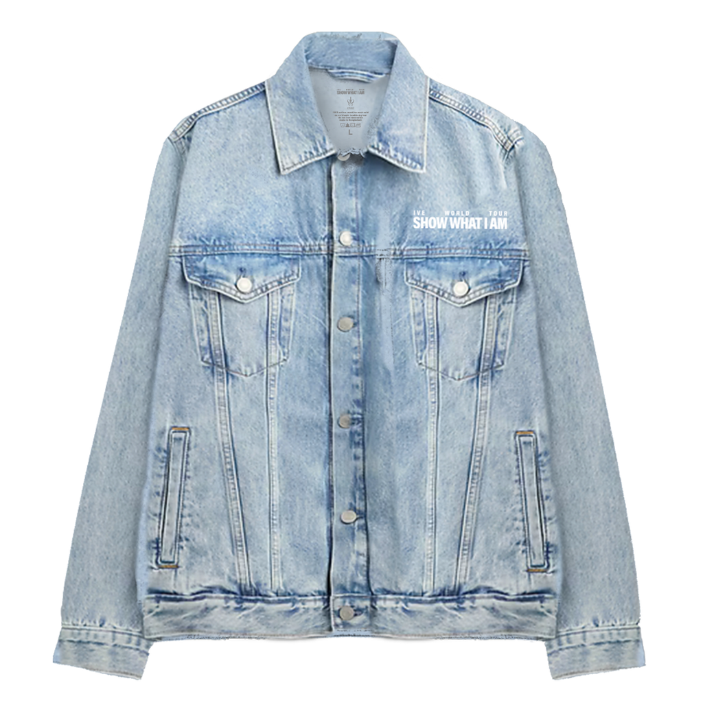 A light blue denim jacket with a button-up front, chest flap pockets, and white text on the left chest reading 'IVE WORLD TOUR SHOW WHAT I AM'.