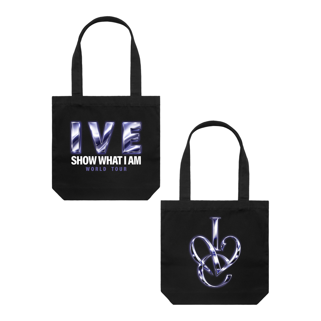 Black canvas tote bag with front and back shown side by side. The front features the text 'IVE SHOW WHAT I AM WORLD TOUR' in metallic silver and blue, and the back features an interlocking design 'IVE' logo in metallic silver and blue. 