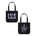 Black canvas tote bag with front and back shown side by side. The front features the text 'IVE SHOW WHAT I AM WORLD TOUR' in metallic silver and blue, and the back features an interlocking design 'IVE' logo in metallic silver and blue. 