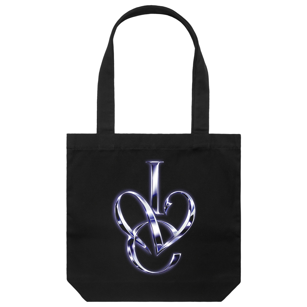 A black canvas tote bag with two shoulder straps, featuring a metallic silver and blue stylized 'IVE' monogram graphic printed on the front.