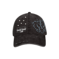 A distressed black baseball cap featuring a gray gothic-style 'IVE' logo on the side, white text reading 'IVE WORLD TOUR SHOW WHAT I AM' with small star accents on the front, and silver metal studs on the upper right panel.