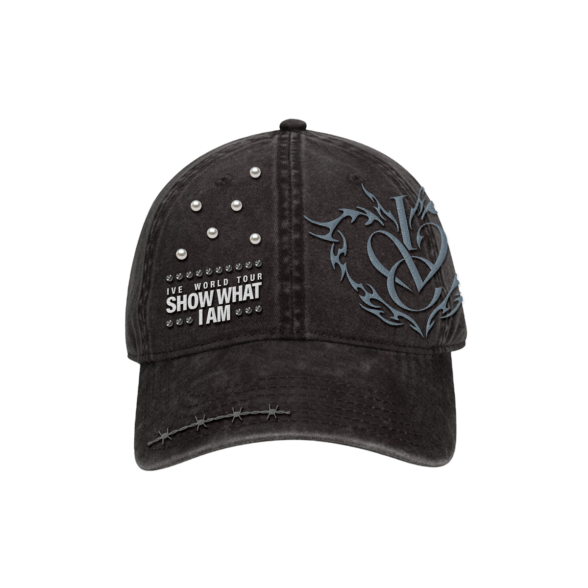 A distressed black baseball cap featuring a gray gothic-style 'IVE' logo on the side, white text reading 'IVE WORLD TOUR SHOW WHAT I AM' with small star accents on the front, and silver metal studs on the upper right panel.