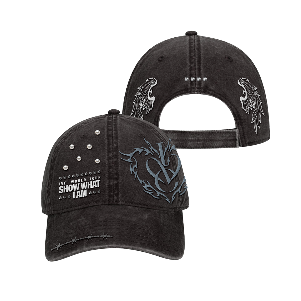 A black washed baseball cap shown from the front and back. The front features white embroidered text reading 'IVE WORLD TOUR SHOW WHAT I AM' surrounded by studs, a large gray and black gothic-style monogram on the side, and silver rhinestone embellishments on the front and back.